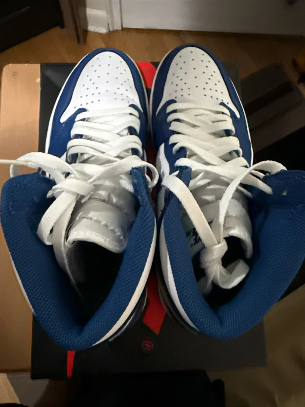 Jordan Air Jordan 1 Mid White and Blue Sneakers